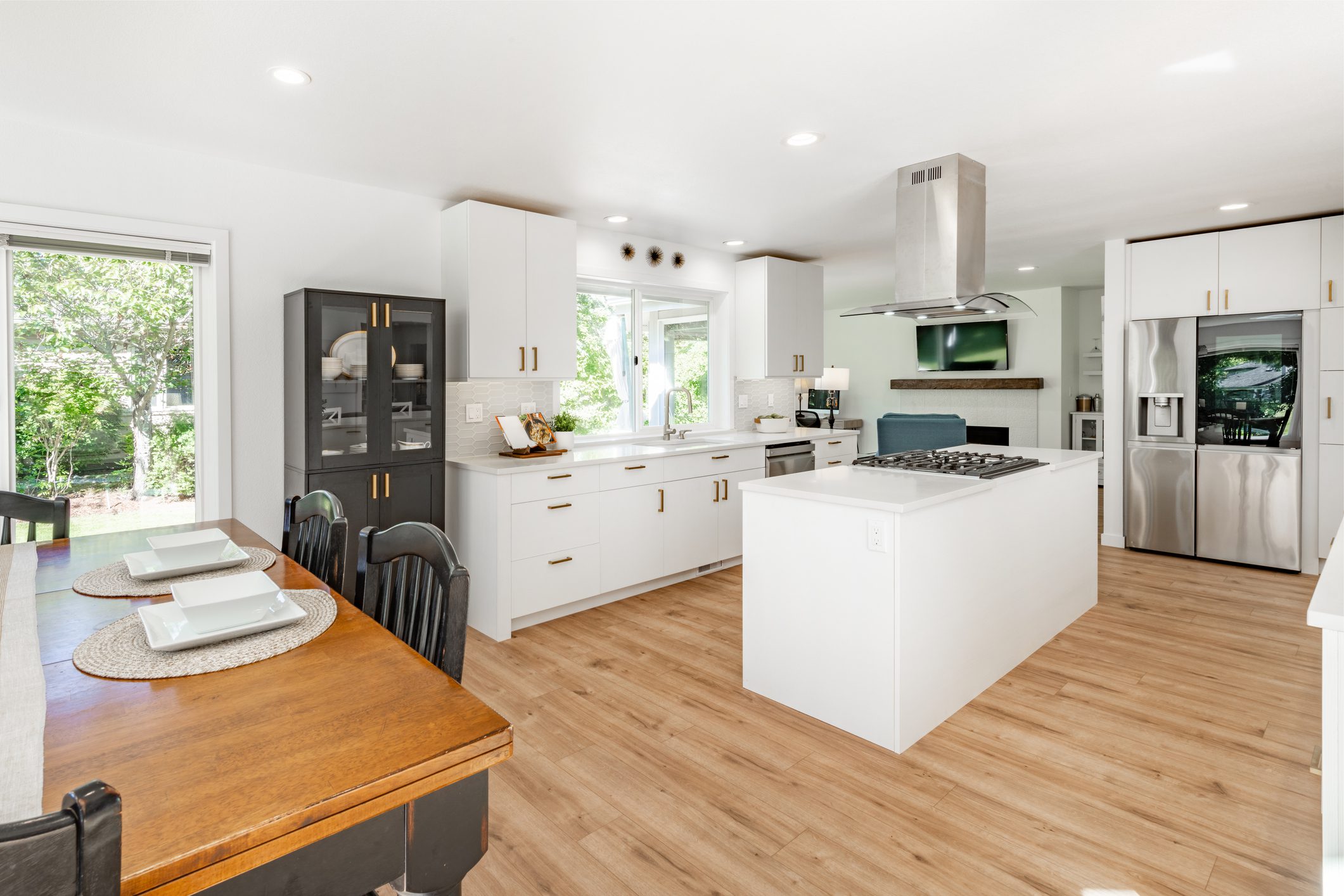 Bright kitchen with island and table